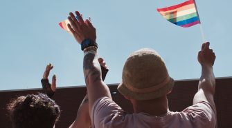 Two People holding Pride Flags