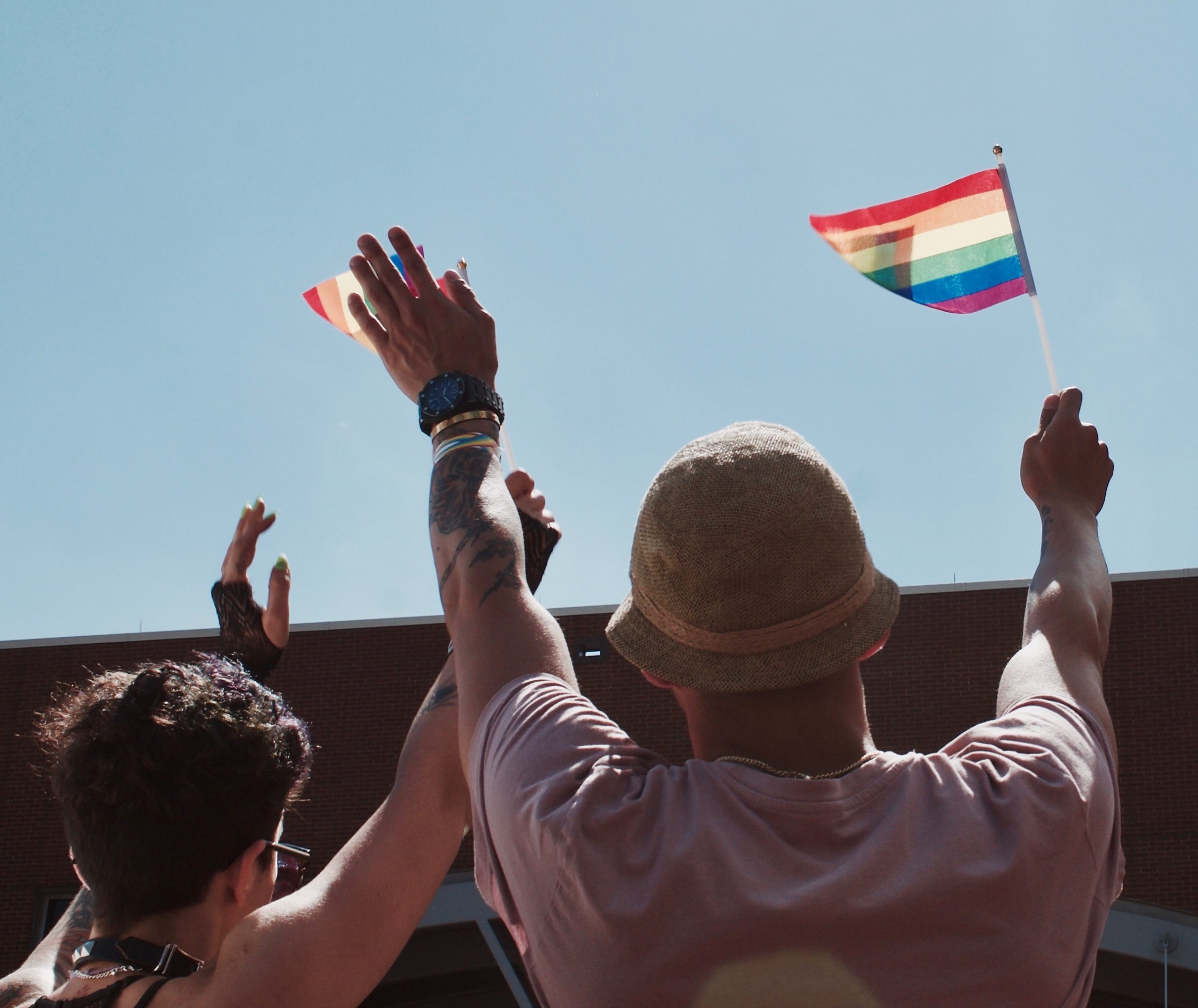 Two People holding Pride Flags